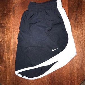 Navy and light blue Nike running shorts, size m.